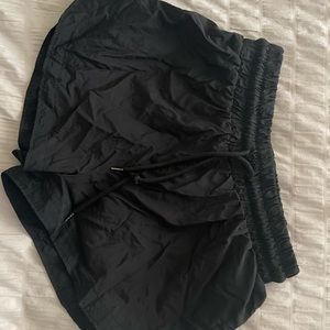 black work out shorts with draw string. windbreaker material.